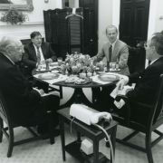 Left to Right: Max M. Fisher, Chief of Staff John Sununu, Secretary of State James Baker, and President George H.W. Bush have a working lunch in the White House.