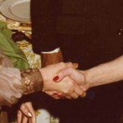 Marjorie Fisher shakes hands with Jihan Sadat, the wife of Eyptian President Anwar Sadat.