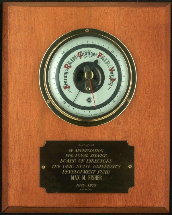 A commemorative barometer given to Max Fisher by Ohio State University in appreciation of his five year term on the Board of Directors from 1970-1975.