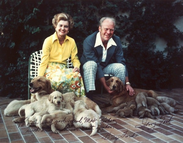 A signed photo of Gerald and Betty Ford with their dogs.