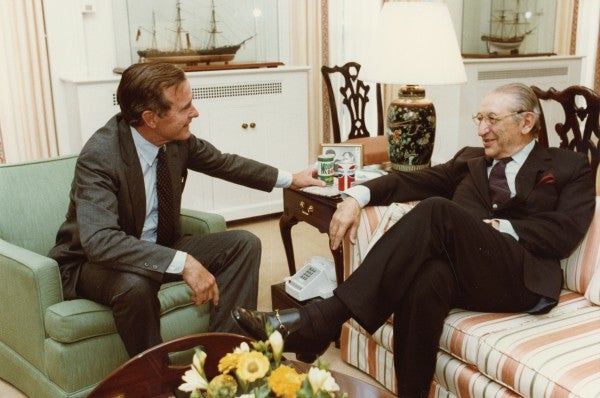 Max M. Fisher and George H. W. Bush share a laugh at the White House.