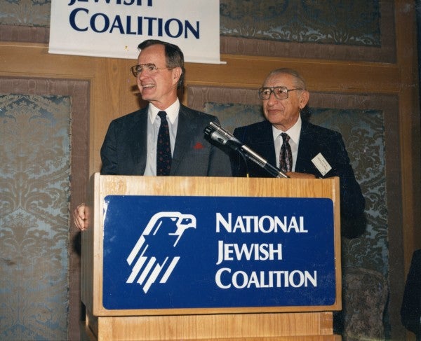 Max M. Fisher with George H. W. Bush at a meeting of the National Jewish Coalition.