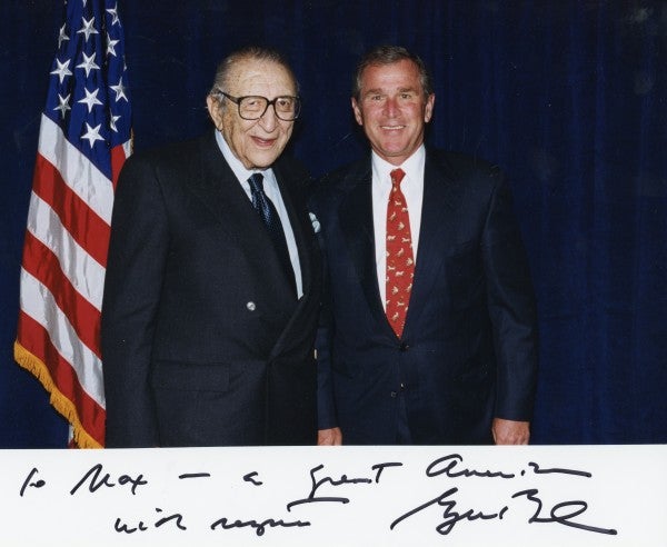 A signed photo to Max M. Fisher from President George W. Bush.