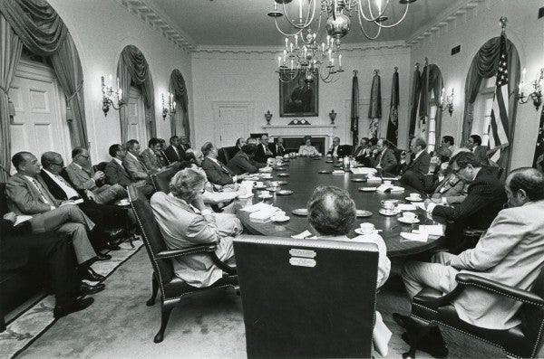 President Gerald Ford holds a meeting at the White House. 