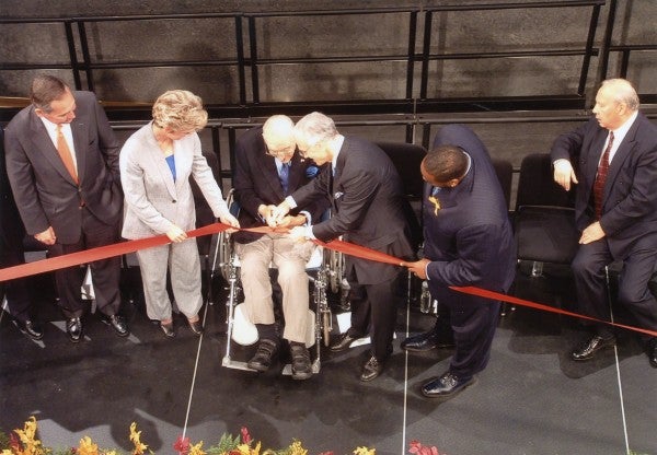 Max Fisher cutting the ribbon for the opening of the Max M. Fisher Music Center in 2003.