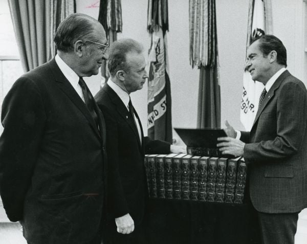 President Nixon is presented with his personal copy of the first major Jewish encyclopedia to be published in 65 years. The presentation, in the Oval Office, is made by Mr. Max M. Fisher and Ambassador Yitzhak Rabin of Israel.