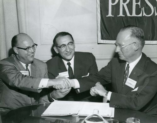 William E. Slaughter and Max M. Fisher of Aurora Gasoline Company with J.C. Donnell II of The Ohio Oil Company.